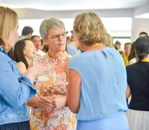 Ivanka Menken in conversation with founders at a gathering